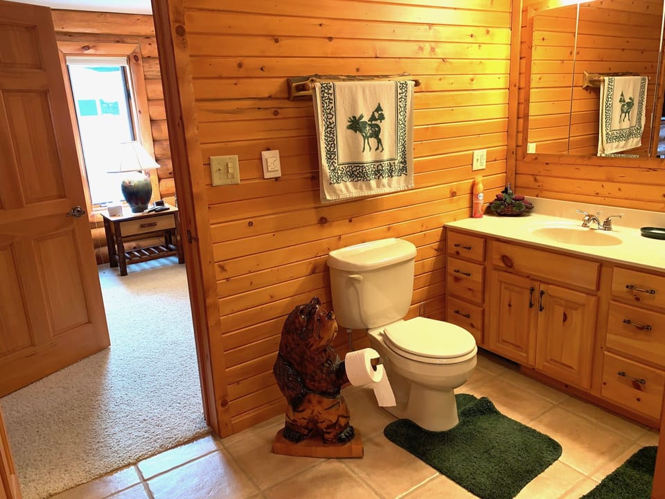 Main floor bathroom, includes tub and shower combo.