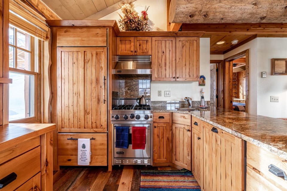 Another view of kitchen with granite & stainless appliances.