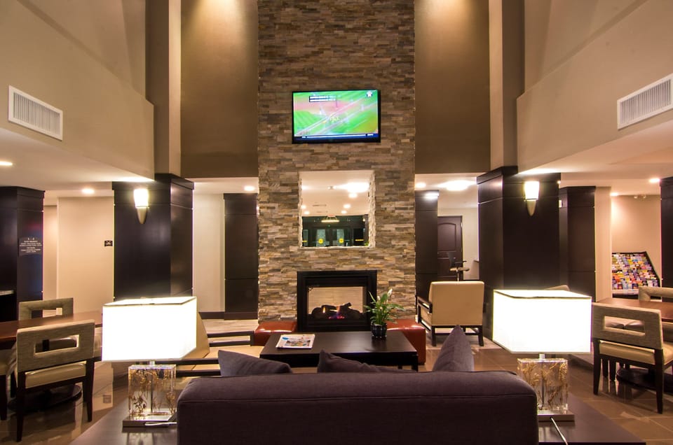 Modern common area with lounge seating and fireplace.