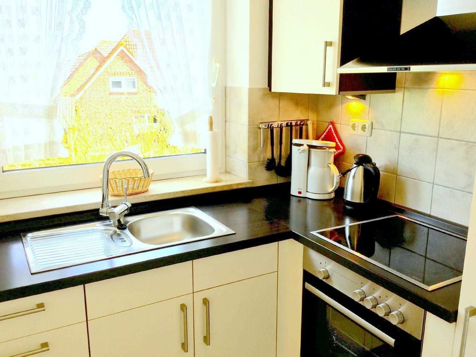 Vacation apartment Luv - Holiday apartments Am alten Deich in the guest house Apartment in Wangerland