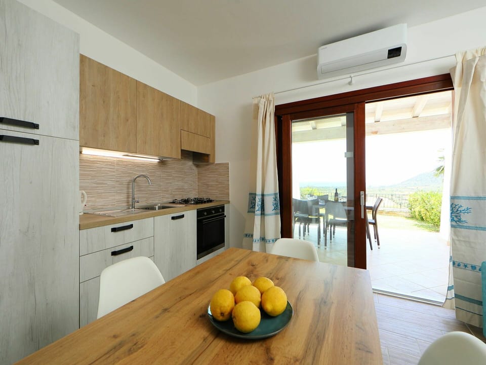 Room, Yellow, Property, Furniture, Interior Design, Countertop, Floor, Kitchen, House, Building