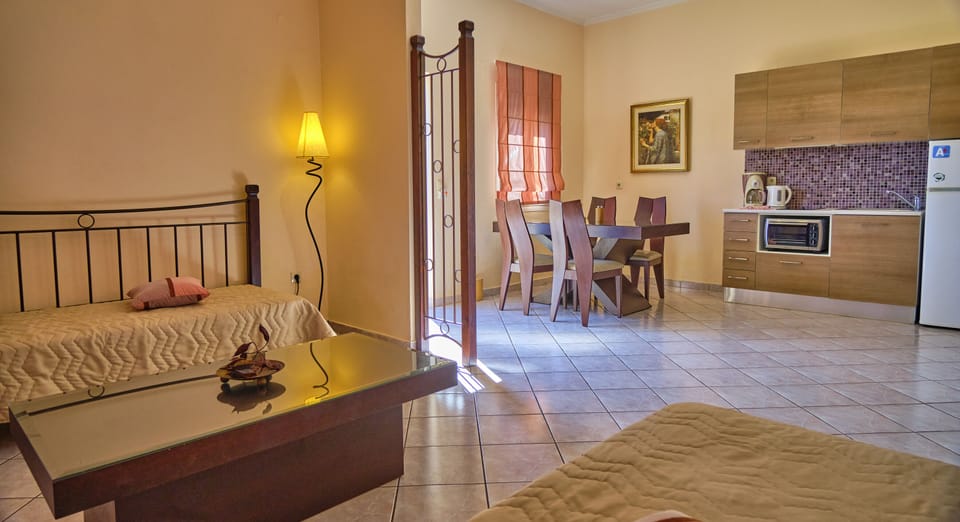 Chrismos Luxury Suites 4A Apraos Corfu - living room - sofa beds and dining area
