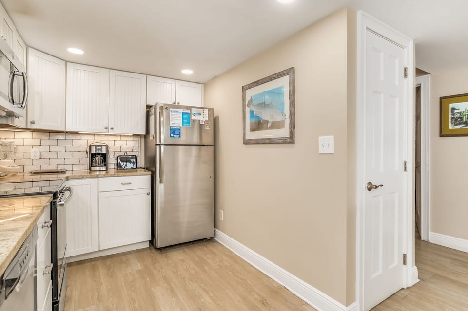 Fully equipped kitchen with large breakfast bar at Wind Drift Orange Beach