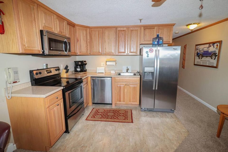 Remodeled kitchen is fully-equipped with pots, pans & utensils.