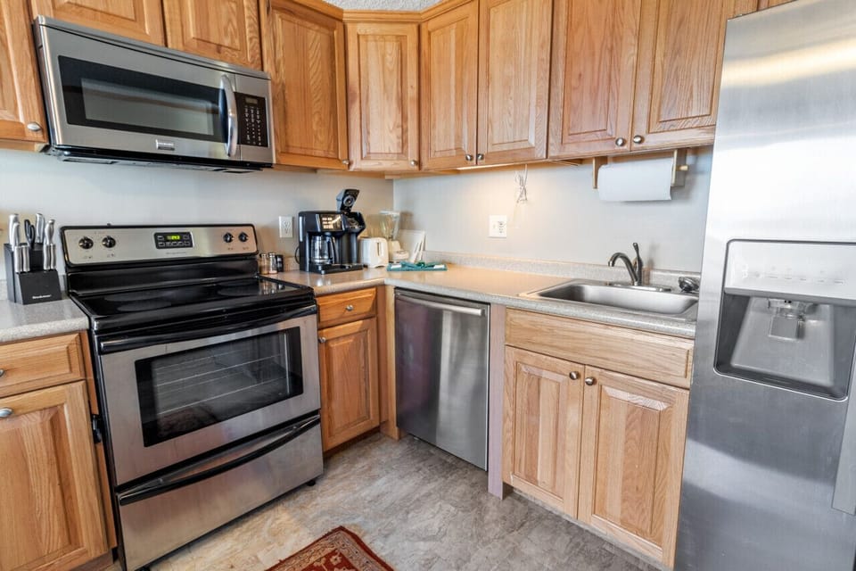Remodeled kitchen is fully-equipped with pots, pans & utensils.