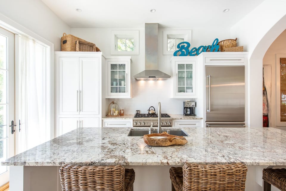 Kitchen Island, Stools, Refrigerator, and Window Doors.