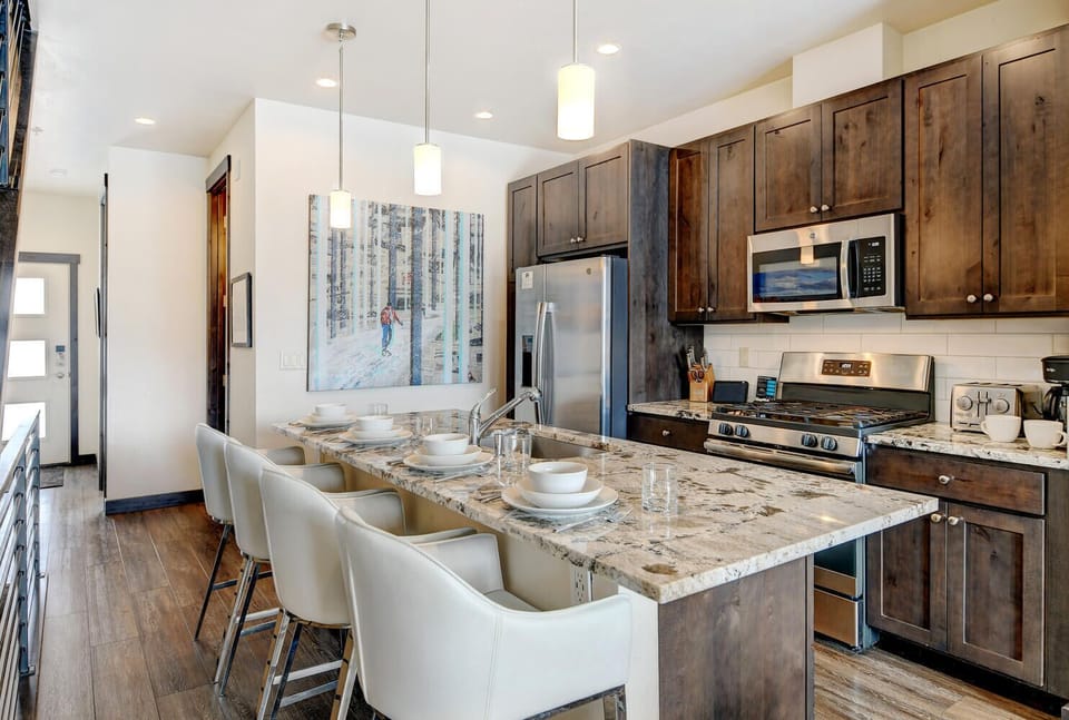 Fully Equipped Kitchen with Large Island Seating for Four