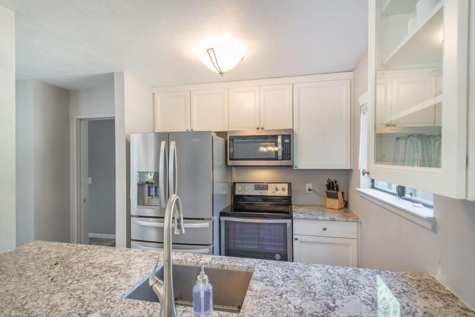 Clean kitchen with quality appliances and fixtures.