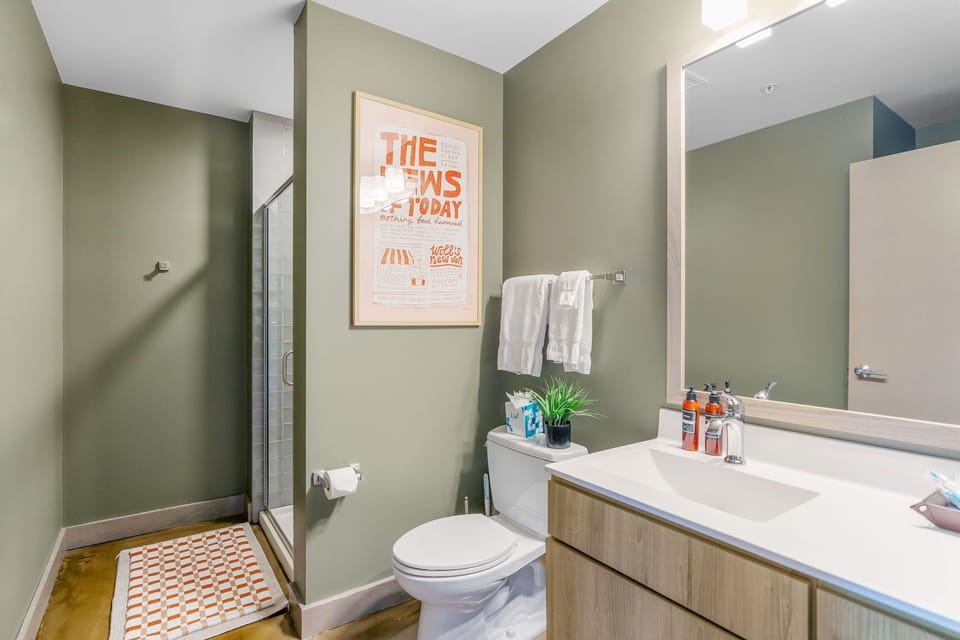 Freshen up in your stylish bathroom with modern fixtures, plenty of counter space, and thoughtful touches for your comfort.