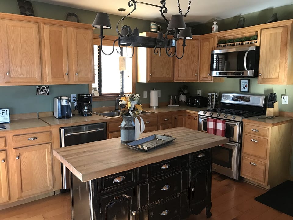 Kitchen view, Dishwasher and gas range with microwave. Kitchen fully stocked. 