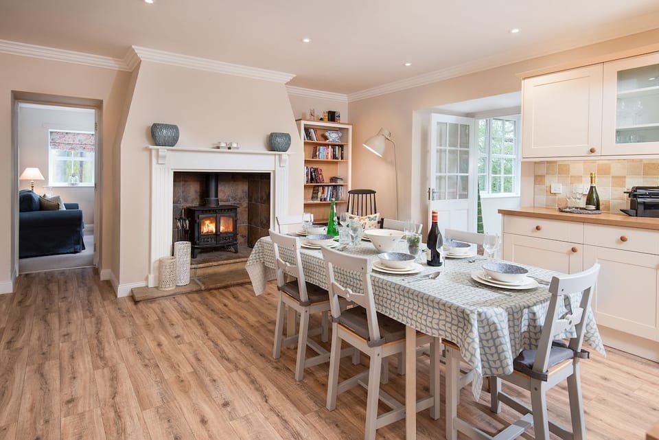 Berryburn Cottage - dining area in the kitchen with wood burning stove
