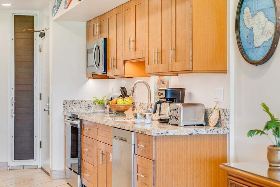 Kitchen featured bamboo cabinet and stainless steel appliance