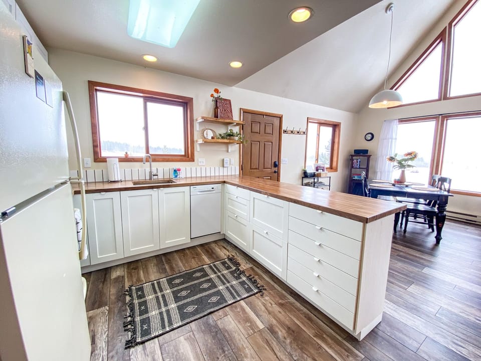 Kitchen has everything needed to make meals, plus a view.
