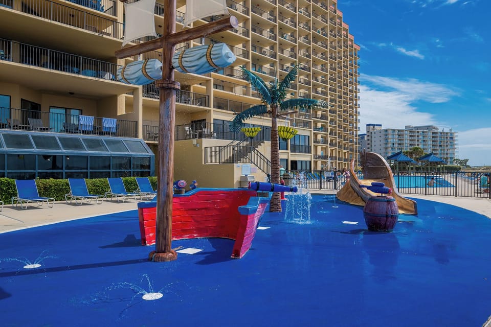 Splash into fun at this mini water park with playful water features and a colorful pirate ship, perfect for family adventures