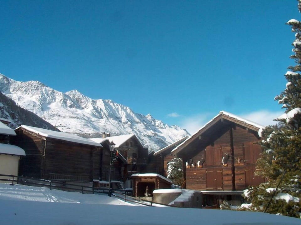 Sky, Cloud, Building, Snow, Mountain, Window, House, Tree, Slope, Freezing