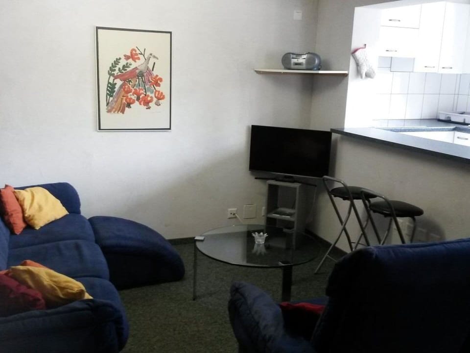 Furniture, Property, Comfort, Living Room, Interior Design, Table, Floor, Television, Home Appliance, Flooring