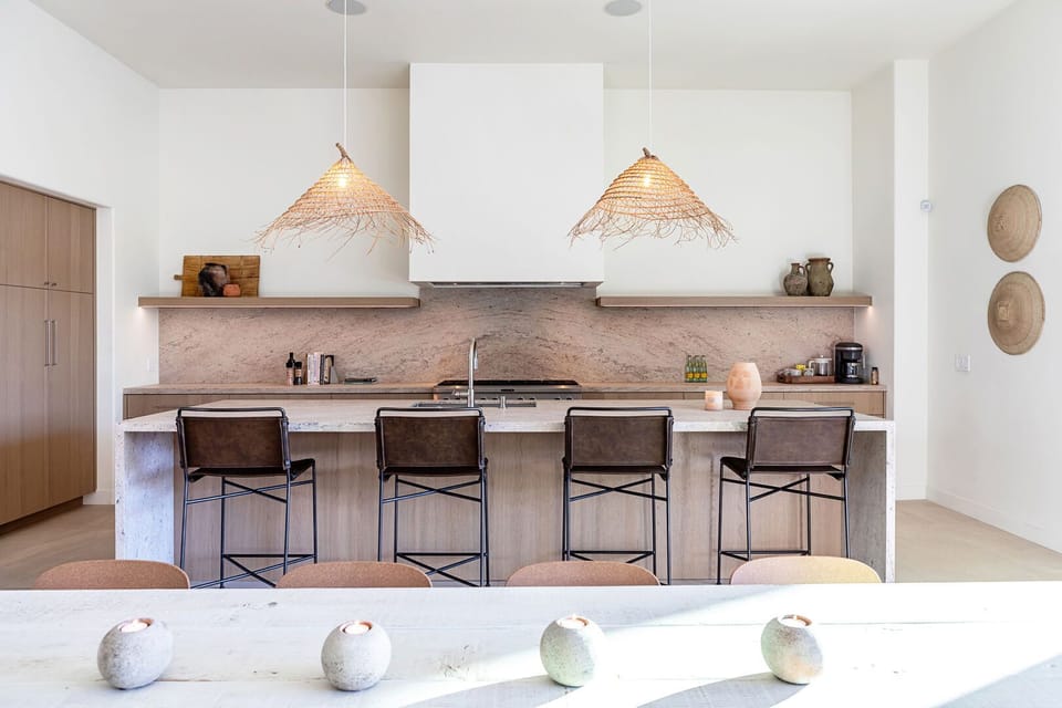 Stylish newly renovated kitchen with large granite waterfall island