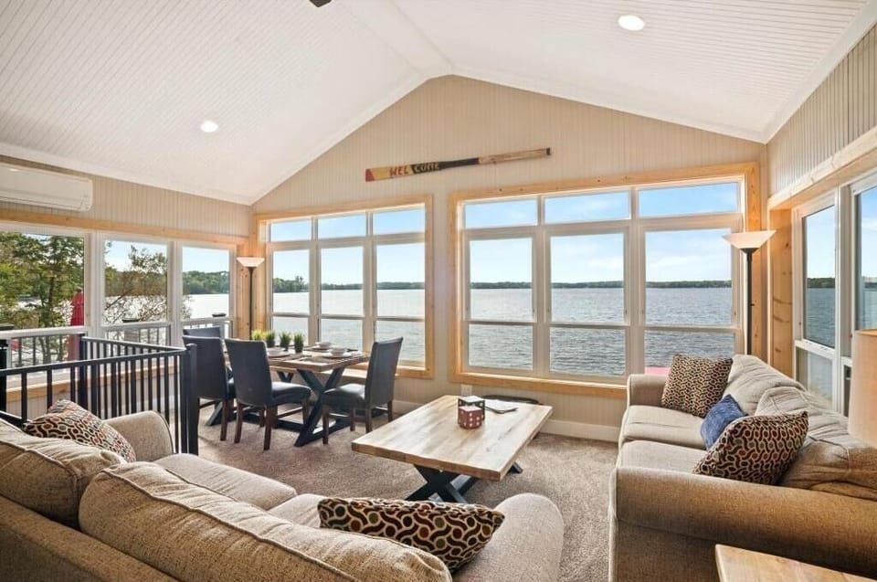 Great room with wrap around windows with outstanding views of the water.