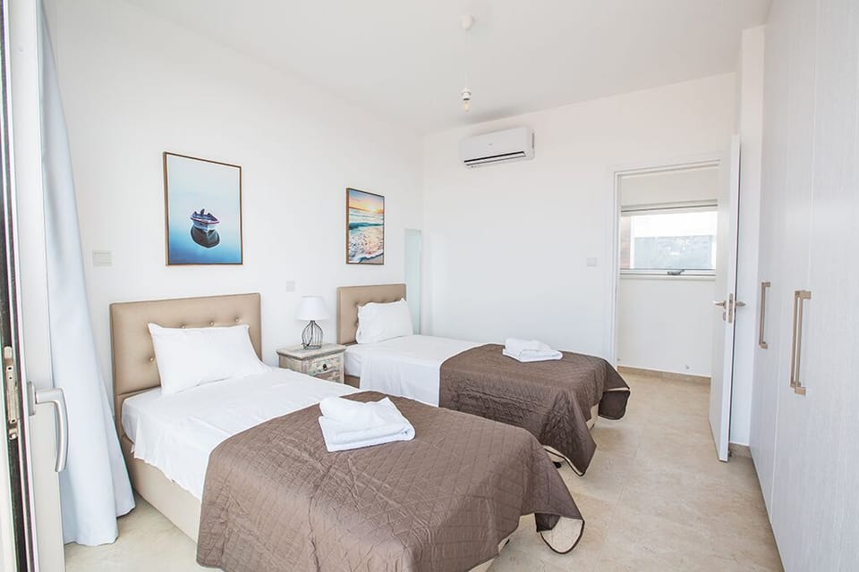 Bedroom 3 with two single beds and space for two extra beds