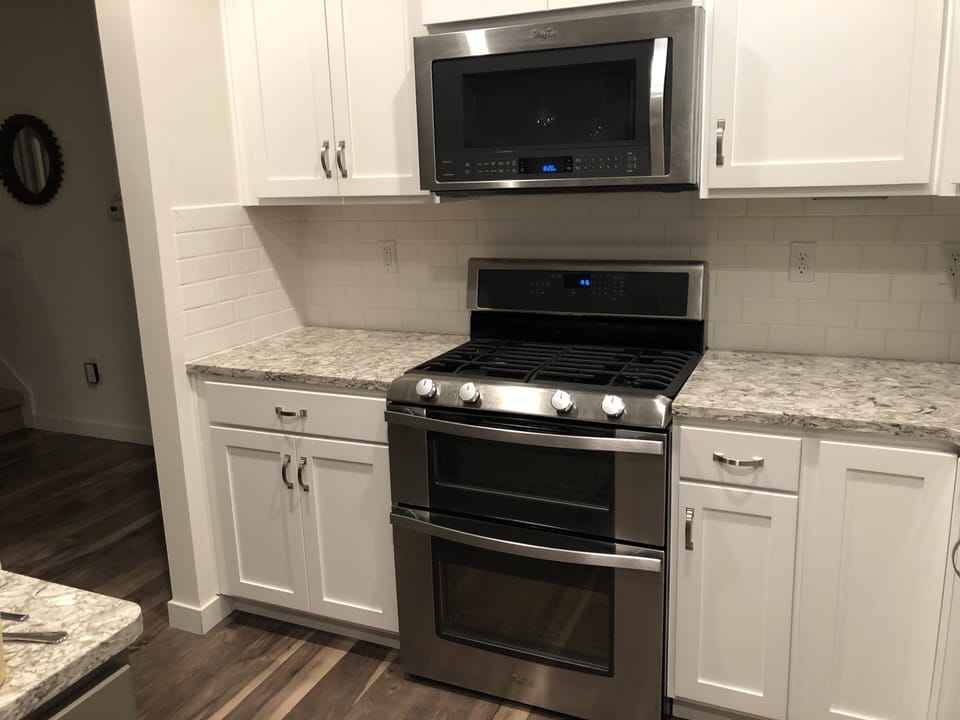 Kitchen with stainless steel gold series Kitchen Aid appliances. 
