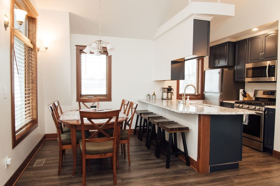Dining room with table & chairs for 6;  4 bar stools for counter seating.