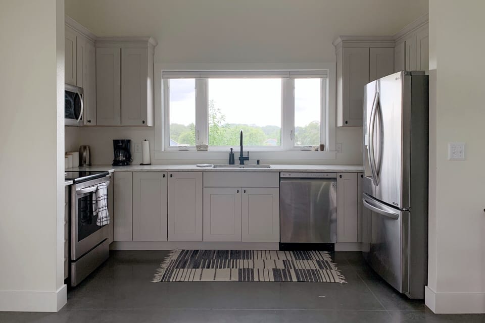 New and full size appliances, filtered water, coffee, kettle, and cookware.
