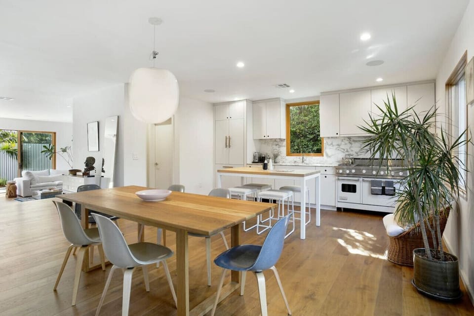 Cozy kitchen dining—perfect for meals with seating for four and and spacious wooden dining table with seating for six.