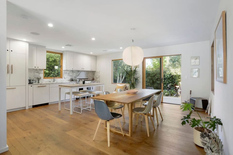 Gather around—spacious wooden dining table with seating for six.