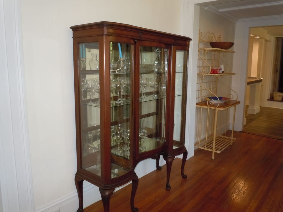 Beautiful cabinet between kitchen and large dining room.