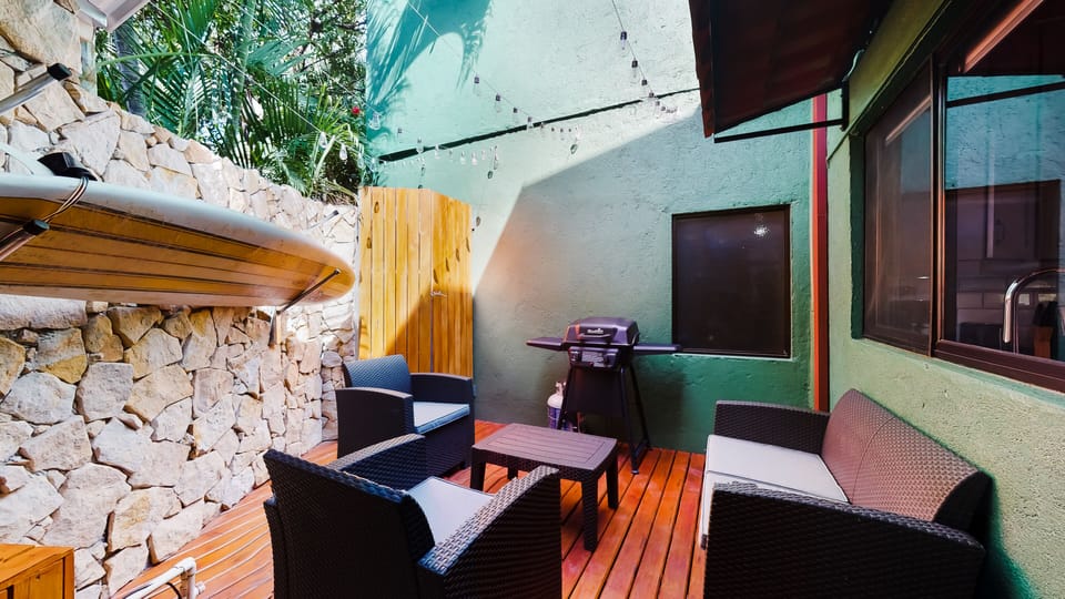 Private rear deck with BBQ grill and surfboard rack