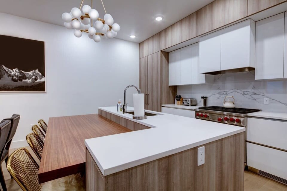 Breakfast bar and kitchen with Wolf range, Sub-Zero refrigerator