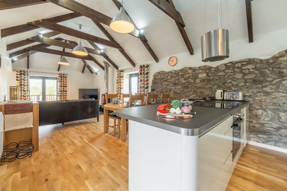 Hunter's Barn, St Agnes. The kitchen overlooks both the dining and living areas