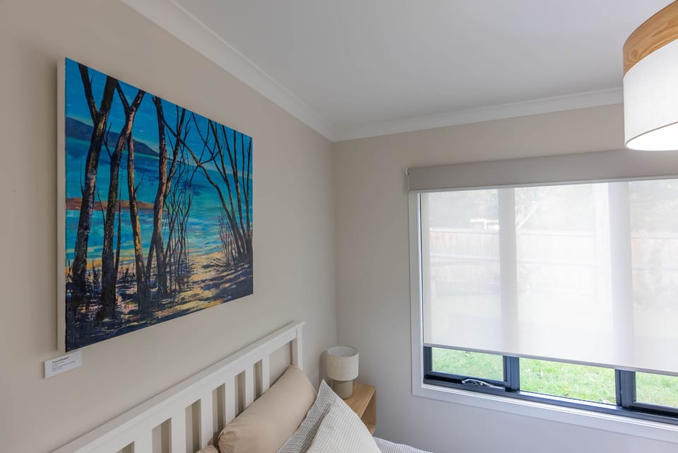 Queen Bedroom with artwork by Catherine Hamilton local artist.