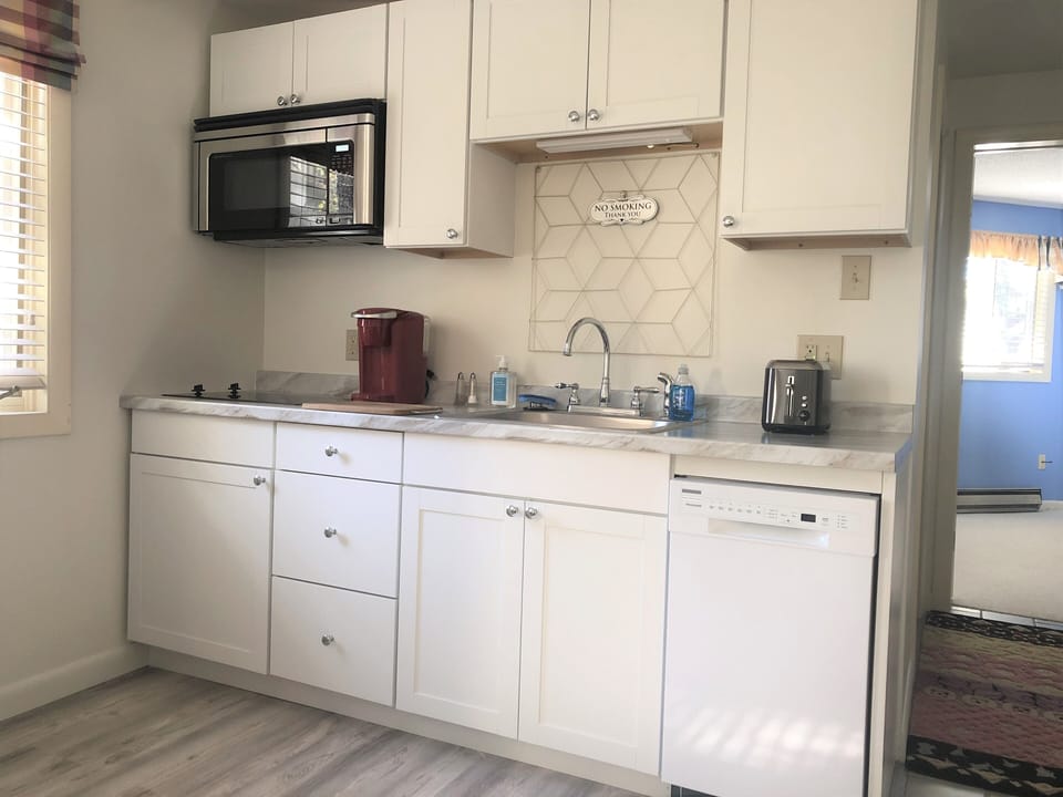 Microwave oven, glass cooktop, dishwasher, Keurig coffee maker