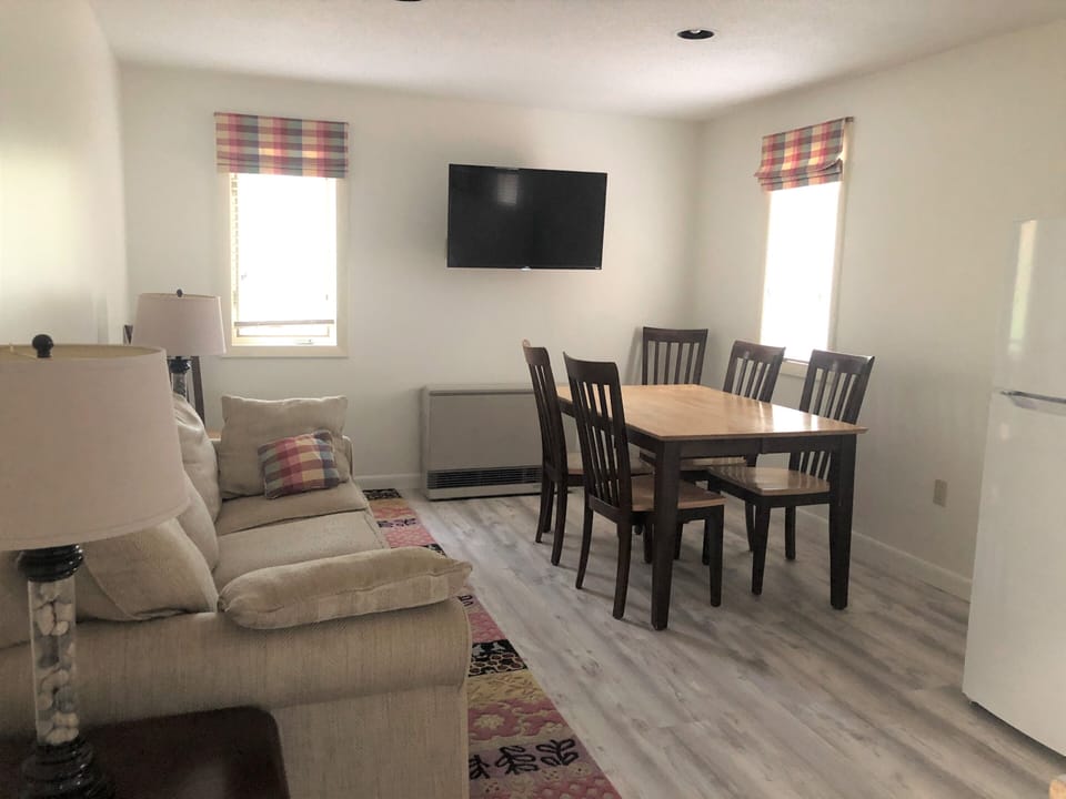 Flat screen Smart TV, table, 6 chairs, comfy sofa