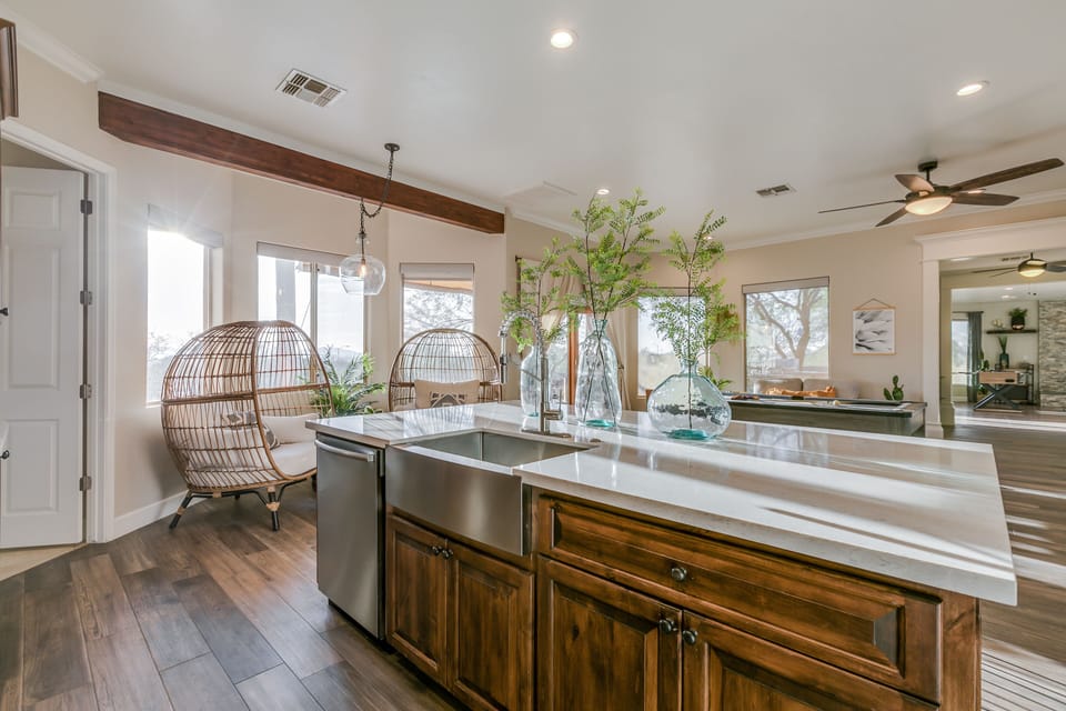 The nook off the kitchen features 2 bohemian chairs for sipping wine or coffee