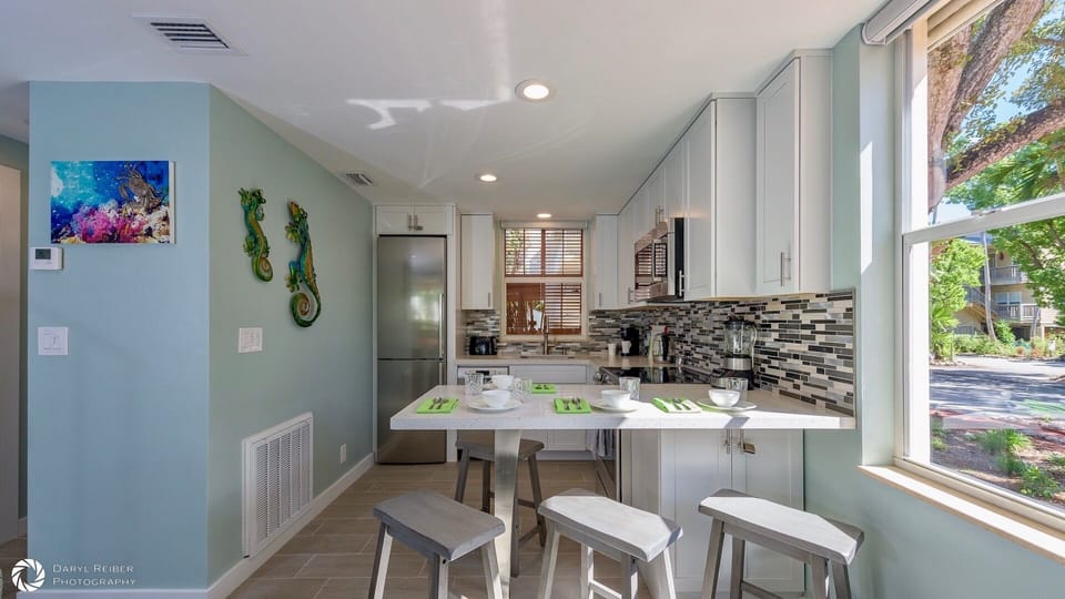 The fully equipped kitchen has brand new stainless steel appliances...