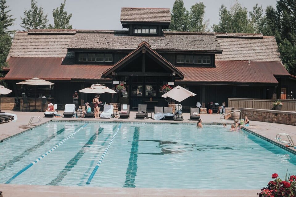Dive into the sunny lap pool beside the lodge.