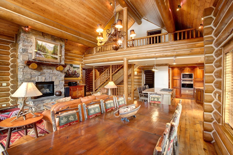 Entertain together in an open great room with stone fireplace.