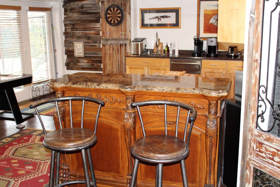 Granite top bar looking through to the kitchen and front door