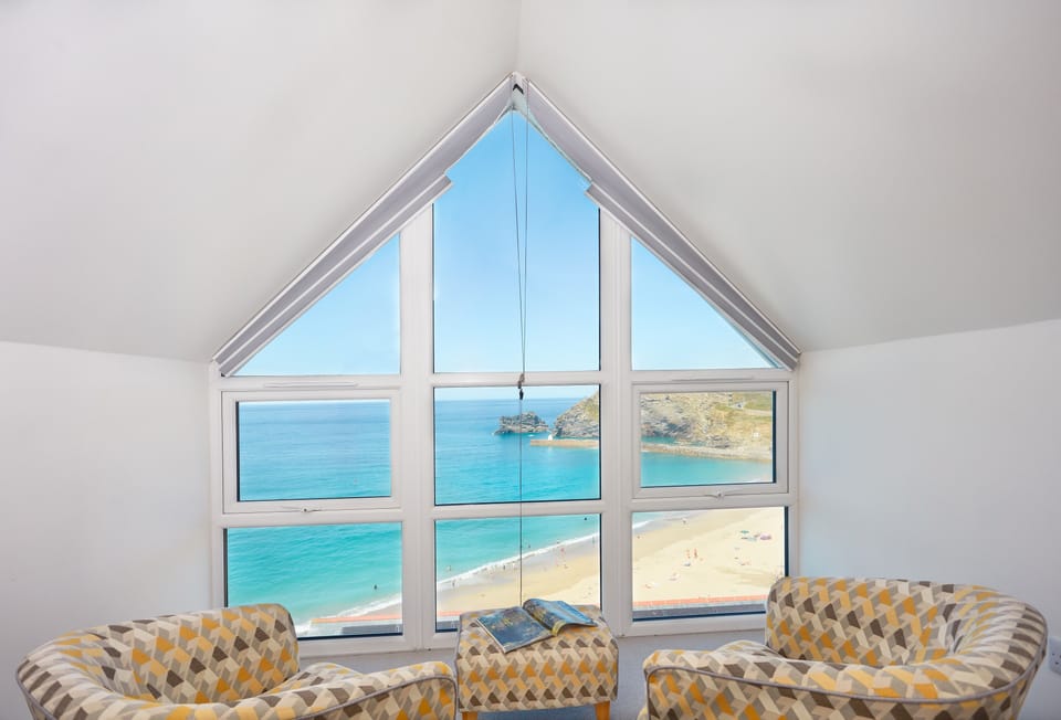 Westaway, Portreath. Third floor: Master bedroom with seating area and panoramic sea views of Portreath