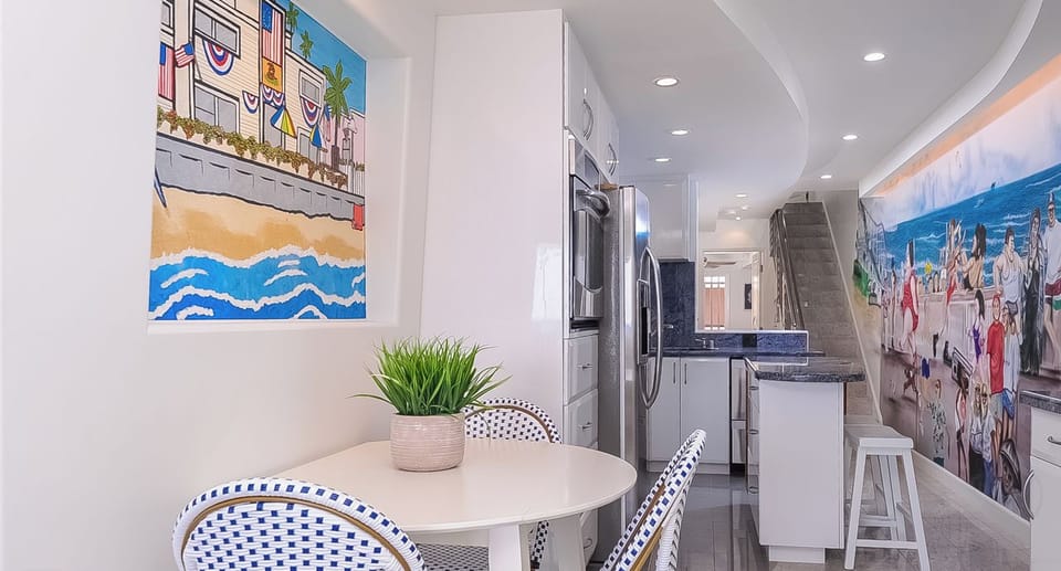 Dining Table and Kitchen w/Island in background  