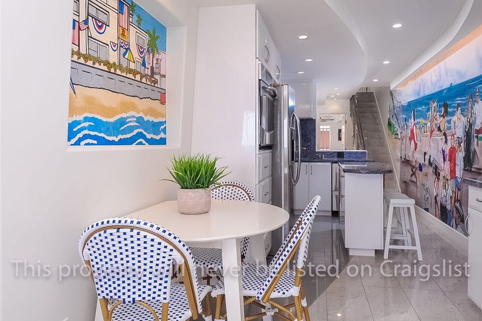 Dining Table and Kitchen w/Island in background  