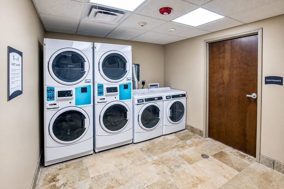 Laundry room with front-loading washers and dryers