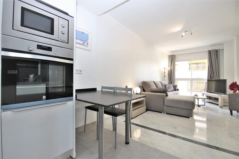 The lounge area from the kitchen with breakfast bar for two