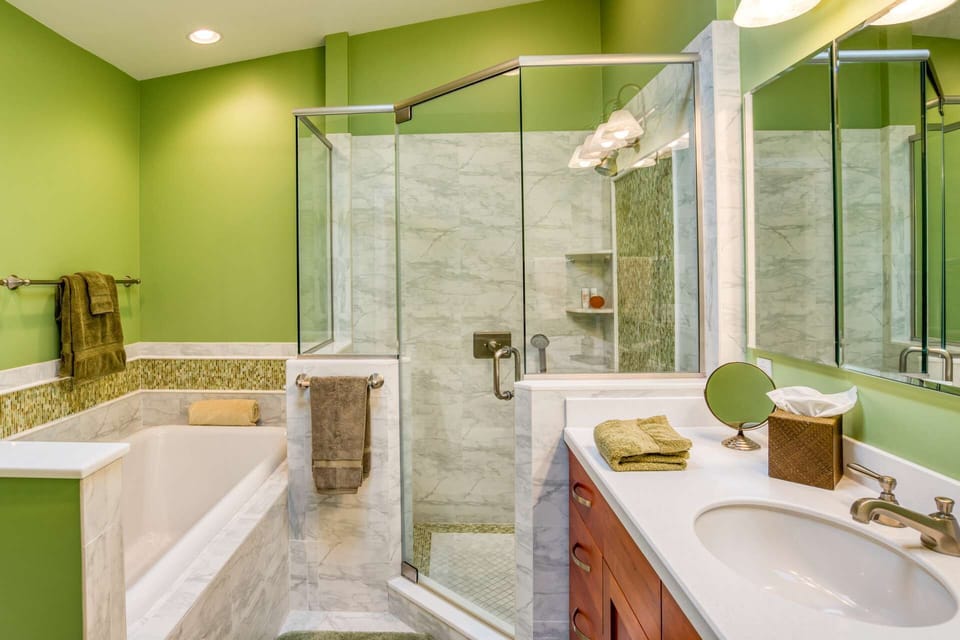 Enjoy updated tile, a modern jacuzzi soaking tub and sauna shower with handheld option.