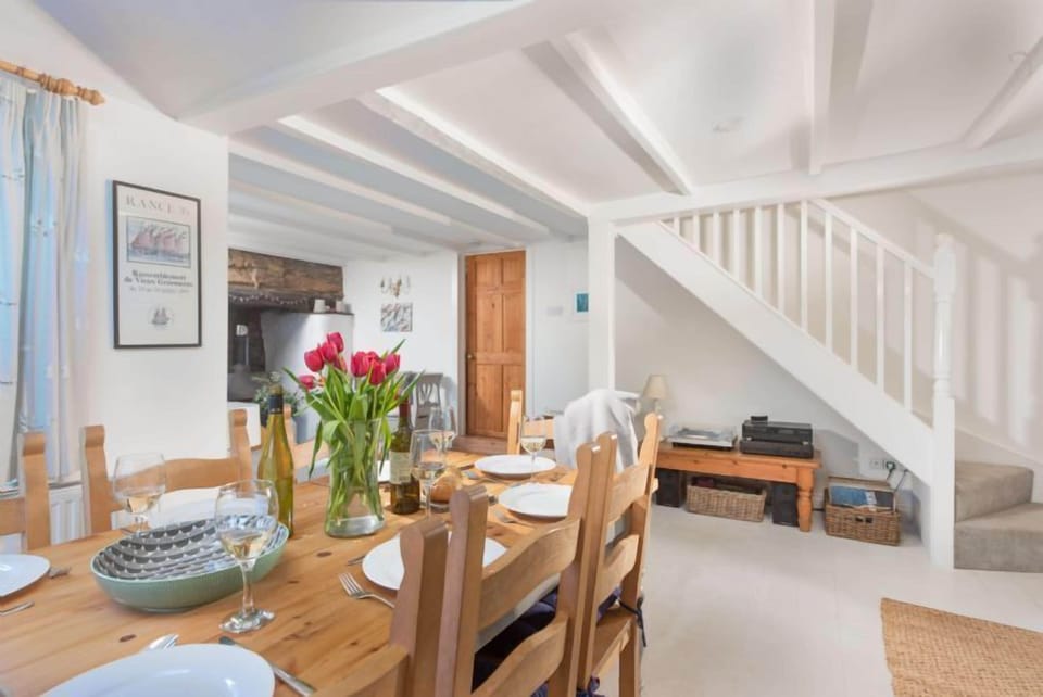 Roseneath, St Agnes. Ground floor: Dining area with table and seating for eight