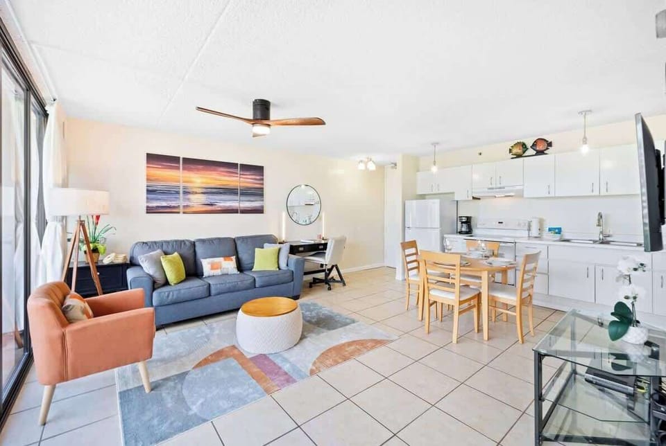 Living room with pull-out sleeper sofa, and dining table with 4 seats.