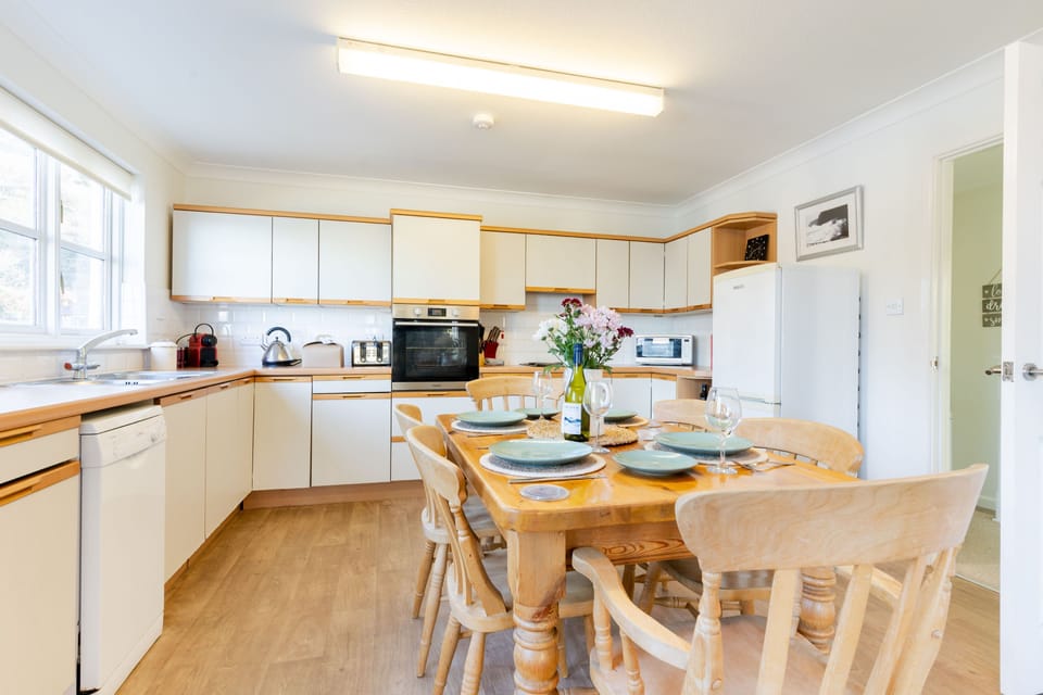 Above the Beach, First Floor: Kitchen area with an oven, hob, fridge/freezer, microwave, coffee machine and dishwasher