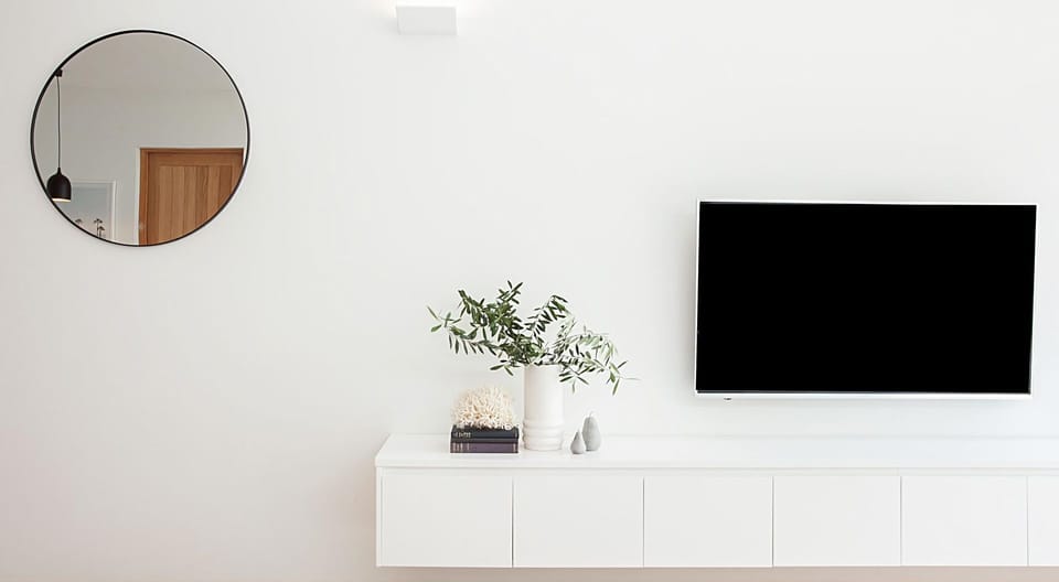 Relax and unwind with entertainment on the large wall-mounted flat-screen TV, perfect for movie nights and catching up on your favorite shows
